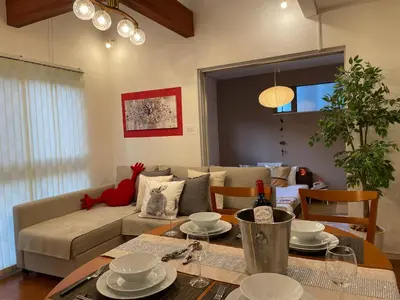 a living room with a couch and a table at Skytree House In Tokyo in Tokyo