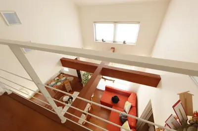 an overhead view of a living room with a red couch at Skytree House In Tokyo in Tokyo