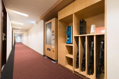 a corridor in a office building with a walkway at Super Hotel Premier Tokyo Station Yaesu-Chuoguchi in Tokyo