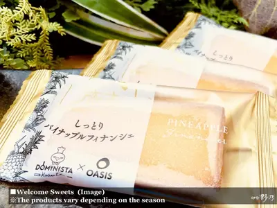 a package of cheese on a table with flowers at Onyado Nono Asakusa Natural Hot Spring in Tokyo
