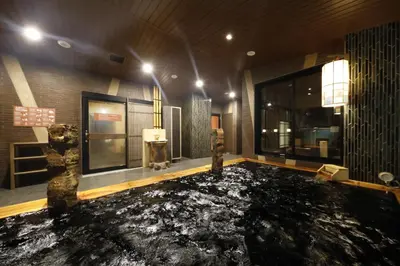 a room with a floor covered in black marble at Onyado Nono Asakusa Natural Hot Spring in Tokyo