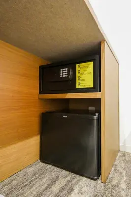 a tv sitting on a shelf in a room at KIN HOTEL in Tokyo