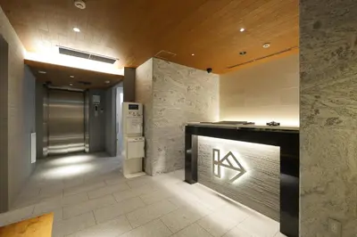 a lobby of a building with a sign on a counter at KIN HOTEL in Tokyo