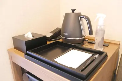 a counter with a coffee maker and a blender on it at KIN HOTEL in Tokyo