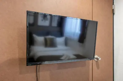 a flat screen tv hanging on a wall at The Park Hotel Akihabara in Tokyo