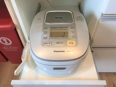 a washing machine is on display in a room at Mori House In \u897f\u65e5\u66ae\u91ccI in Tokyo