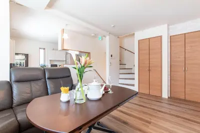 a living room with a table and a couch at Mori House In \u897f\u65e5\u66ae\u91ccI in Tokyo