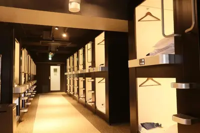 a row of wardrobes in a prison cell at Capsule Room Lightning Hotel Asakusa in Tokyo