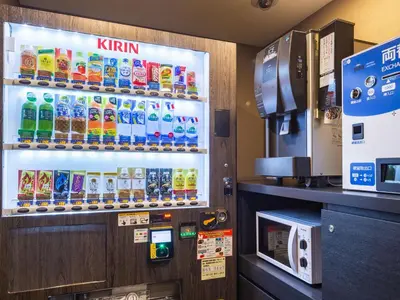 a drink vending machine in a restaurant with drinks at APA Hotel Yamanote Otsuka Ekimae Tower in Tokyo