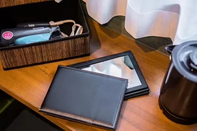 a tablet sitting on a table next to a basket at IKIDANE Residential Hotel Komagome in Tokyo
