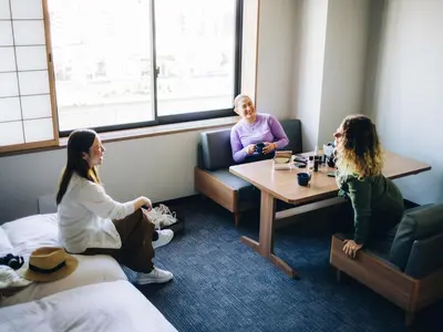 three women sitting around a table in a room at MIMARU Tokyo Ginza East in Tokyo