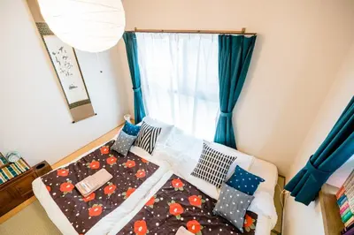 a bed in a room with a window at Bunkyo-ku Hakusan House in Tokyo