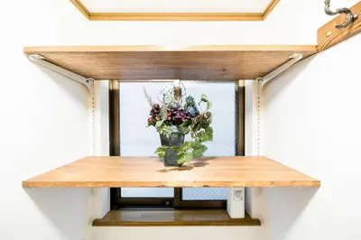 a vase of flowers sitting on a table at Bunkyo-ku Hakusan House in Tokyo