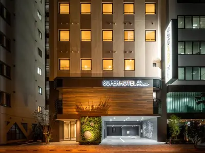 a building with a sign on the front of it at Super Hotel Premier Akihabara in Tokyo