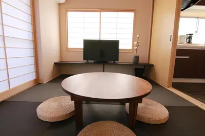 a small room with a table and a television at Sakura Stay Yoga 301 in Tokyo