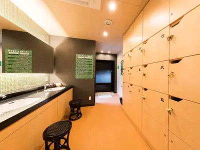 a bathroom with a sink and a counter with lockers at Super Hotel Tokyo Kinshicho Ekimae in Tokyo