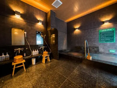 a bathroom with a tub and a sink and a toilet at Super Hotel Tokyo Kinshicho Ekimae in Tokyo