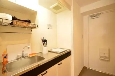 a kitchen with a sink and a counter top at Roppongi Azabu Sunshine Resort House in Tokyo