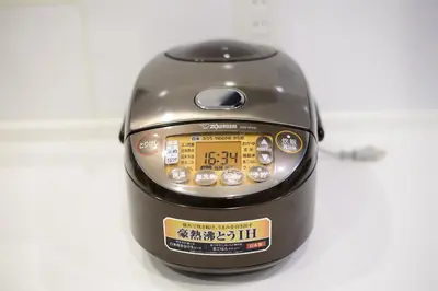 a toaster is sitting on a white table at Sangen-jaya House-O in Tokyo
