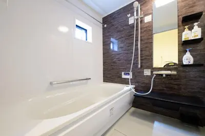 a bathroom with a bath tub and a sink at Sangen-jaya House-O in Tokyo