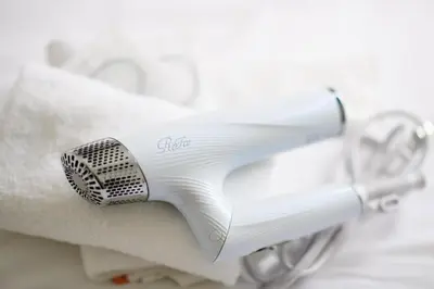 a white toothbrush sitting on top of a towel at Sangen-jaya House-O in Tokyo