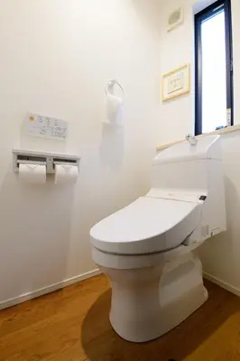 a white toilet in a bathroom with a window at Sangen-jaya House-O in Tokyo