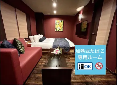 a hotel room with a bed and a couch at Hotel Asian Color (Adult Only) in Tokyo