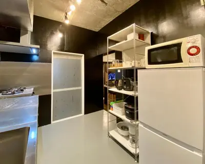 a kitchen with a white refrigerator and a microwave at Shibuya Center Mansion#2DK in Tokyo