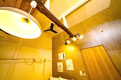 a bathroom with a light and a mirror at SMILE STAY Shinnakano in Tokyo