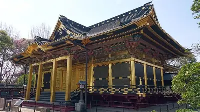 a yellow building with a black roof at Sakura Cross Hotel Ueno Okachimachi in Tokyo