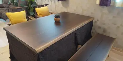 a wooden table with a plant on top of it at CuteFamilyHouse! 8min Shinjuku 5minJR 3minSubway Cozy,Quiet KidsFree Under6yrs in Tokyo