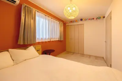 a bedroom with a white bed and a window at CuteFamilyHouse! 8min Shinjuku 5minJR 3minSubway Cozy,Quiet KidsFree Under6yrs in Tokyo