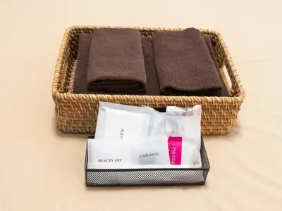 a wicker basket with towels and a towel at Tabist Hotel Florida Ikebukuro in Tokyo