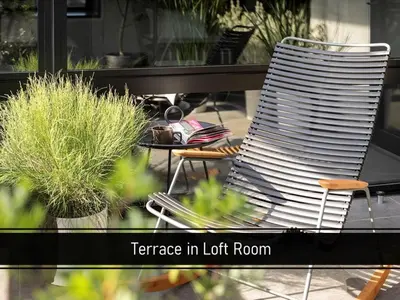 a chair sitting next to a table with plants at THE LIVELY TOKYO AZABUJUBAN in Tokyo