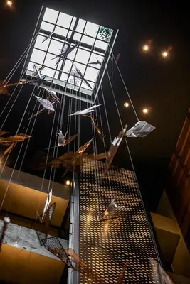 a group of umbrellas are hanging from a building at THE LIVELY TOKYO AZABUJUBAN in Tokyo