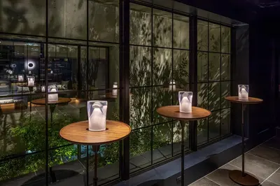 a room with three tables with vases on them at THE LIVELY TOKYO AZABUJUBAN in Tokyo