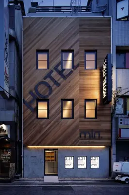a building with a sign on the side of it at hotel min \u5927\u4eba\u5c02\u7528 in Tokyo