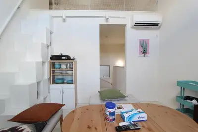 a kitchen with a wooden table in a room at Building A101 / Vacation STAY 1277 in Tokyo