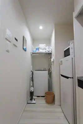 a small kitchen with a refrigerator and a microwave at Building A101 / Vacation STAY 1274 in Tokyo