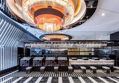 a lobby of a casino with a large chandelier at APA Hotel & Resort Ryogoku Ekimae Tower in Tokyo