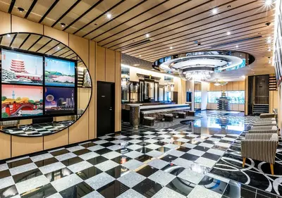 a lobby with a checkered floor and a pool at APA Hotel & Resort Ryogoku Ekimae Tower in Tokyo