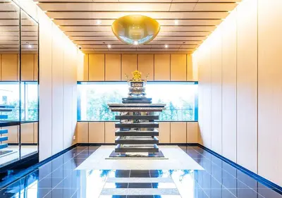 a lobby with a fountain in the middle of a building at APA Hotel & Resort Ryogoku Ekimae Tower in Tokyo