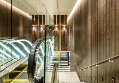 an escalator in a building with an escalator at APA Hotel & Resort Ryogoku Ekimae Tower in Tokyo