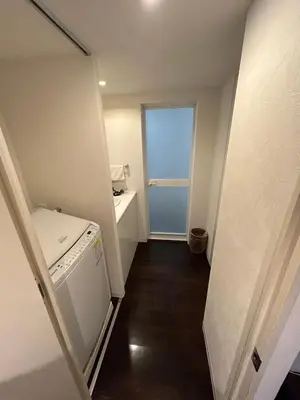 a laundry room with a washer and a window at NIYS apartments 0074 type in Tokyo