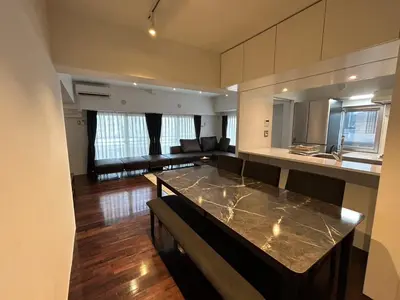 a large kitchen and living room with a counter top at NIYS apartments 0074 type in Tokyo