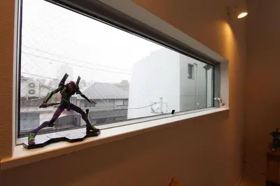 a statue of a person on a skateboard in a window at Building A101 / Vacation STAY 1276 in Tokyo