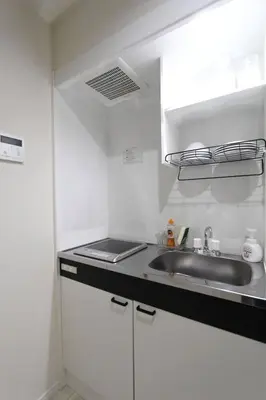 a kitchen with a sink and a counter top at Shibuya-ku - Apartment / Vacation STAY 1103 in Tokyo