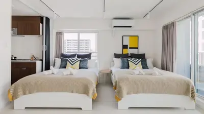 a bedroom with two beds in a room at Hotel Apartment Ueno Inaricho Sta in Tokyo