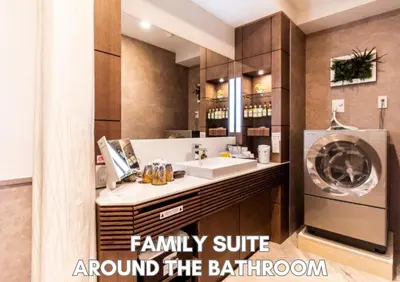 a bathroom with a sink and a washing machine at Hotel Pasela Living Shinjuku in Tokyo