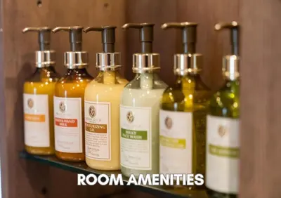 a shelf with a bunch of bottles of sauce at Hotel Pasela Living Shinjuku in Tokyo